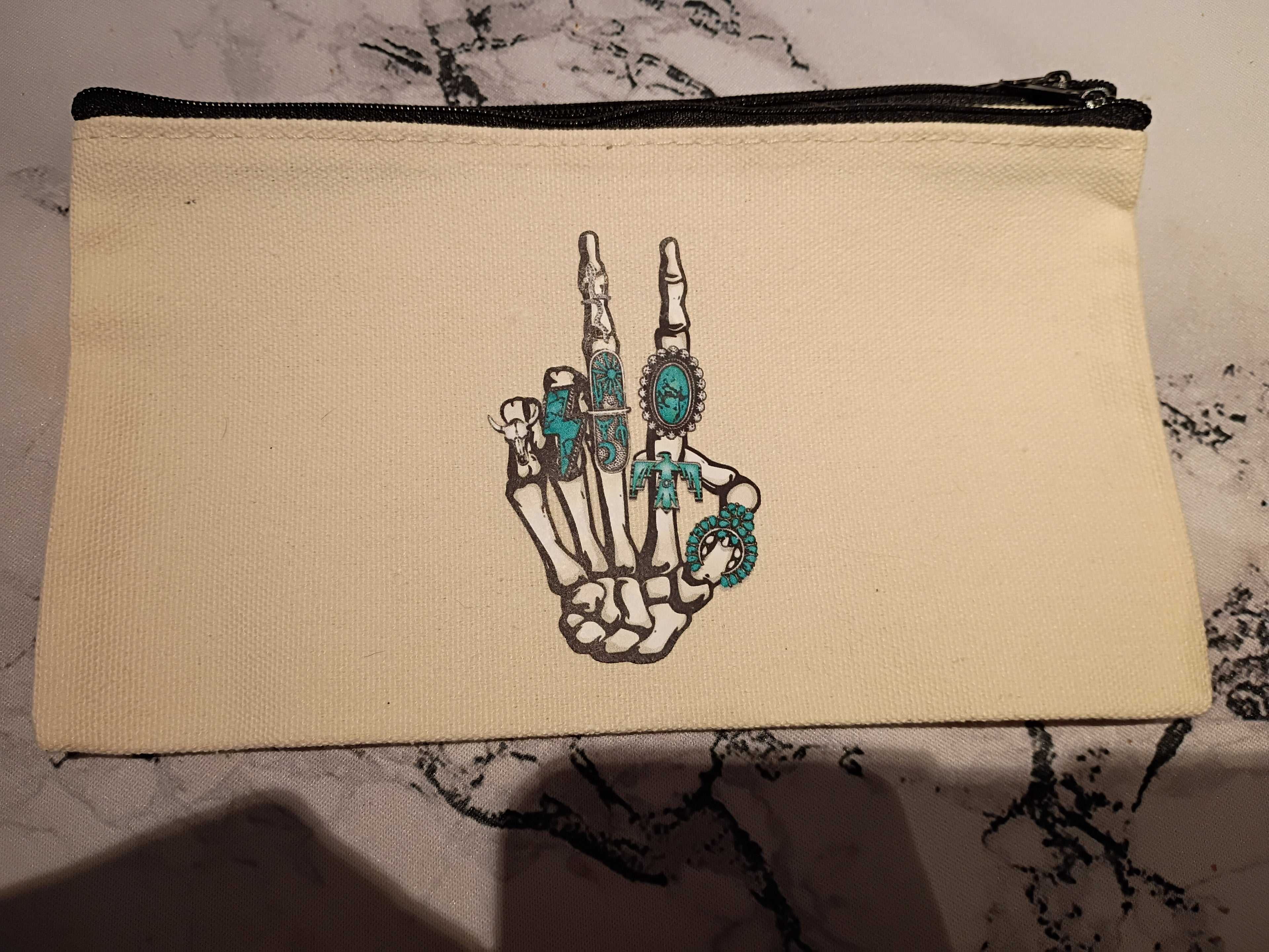 Skeleton hand peace sign